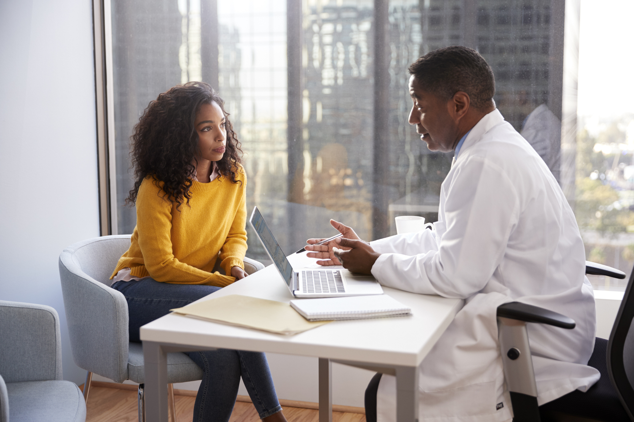 Doctor and patient talking in office