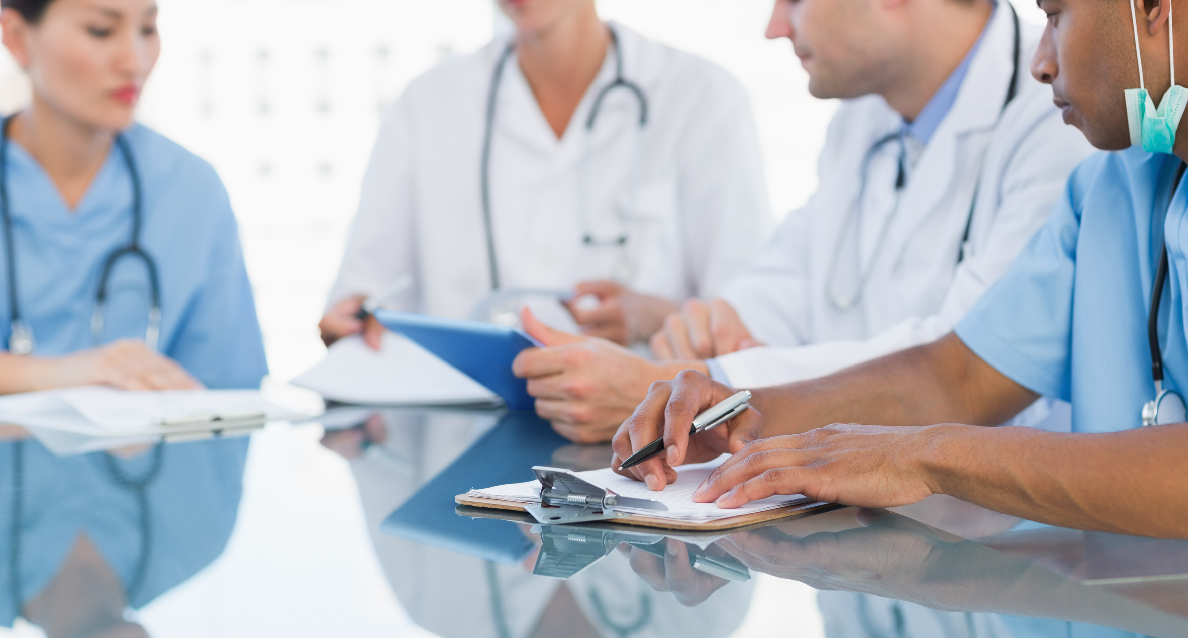 Medical team discussing around table